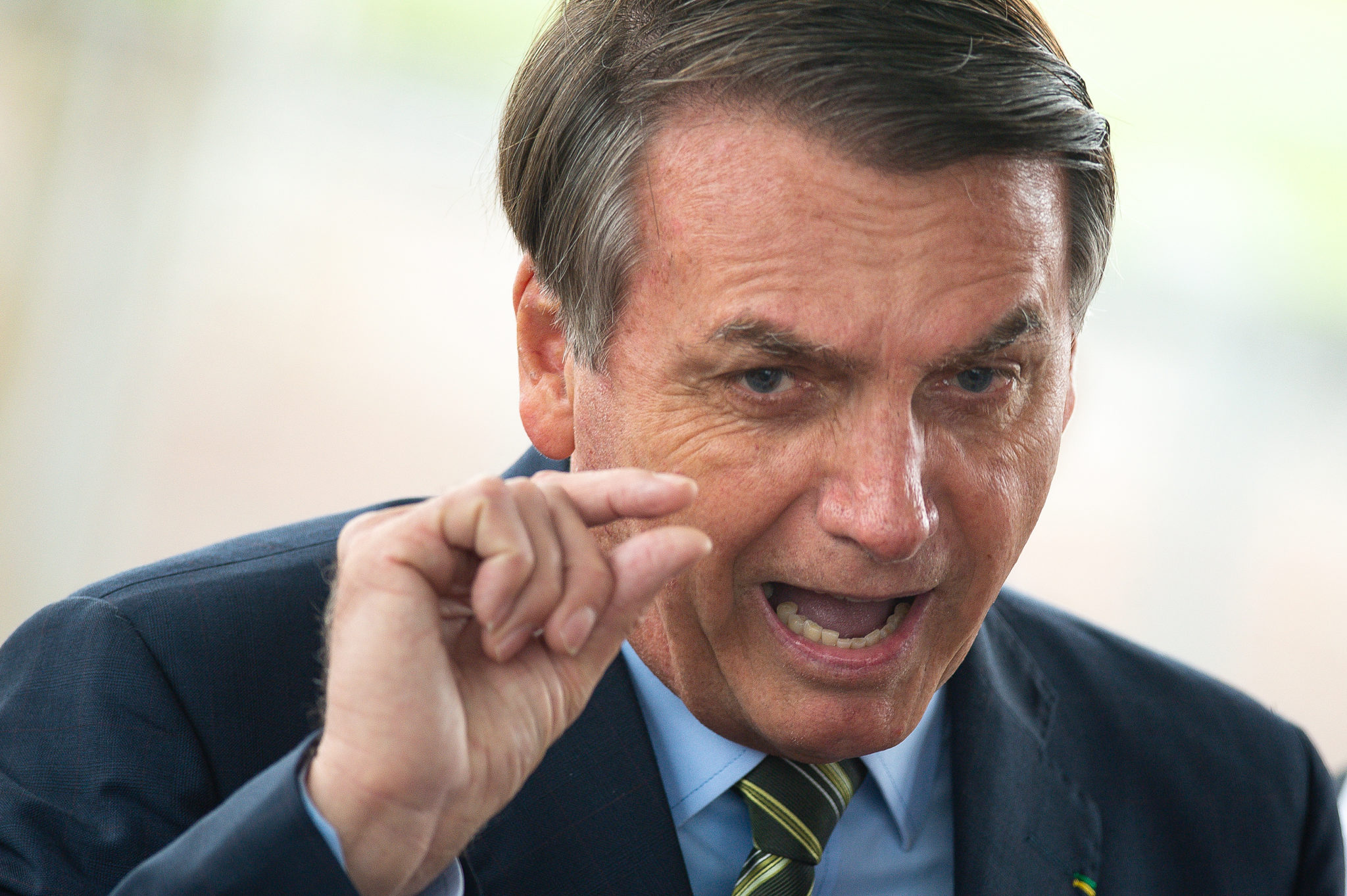 BRASILIA, BRAZIL - MARCH 25: Brazilian President Jair Bolsonaro speaks with press at the official residence during the coronavirus (COVID - 19) pandemic at the Palacio do Alvorada March, 25, 2020 in Brasilia, Brazil. President Bolsonaro recently defended the nation's return to normality and the end of social distancing and quarantine. (Photo by Andressa Anholete / Getty Images)