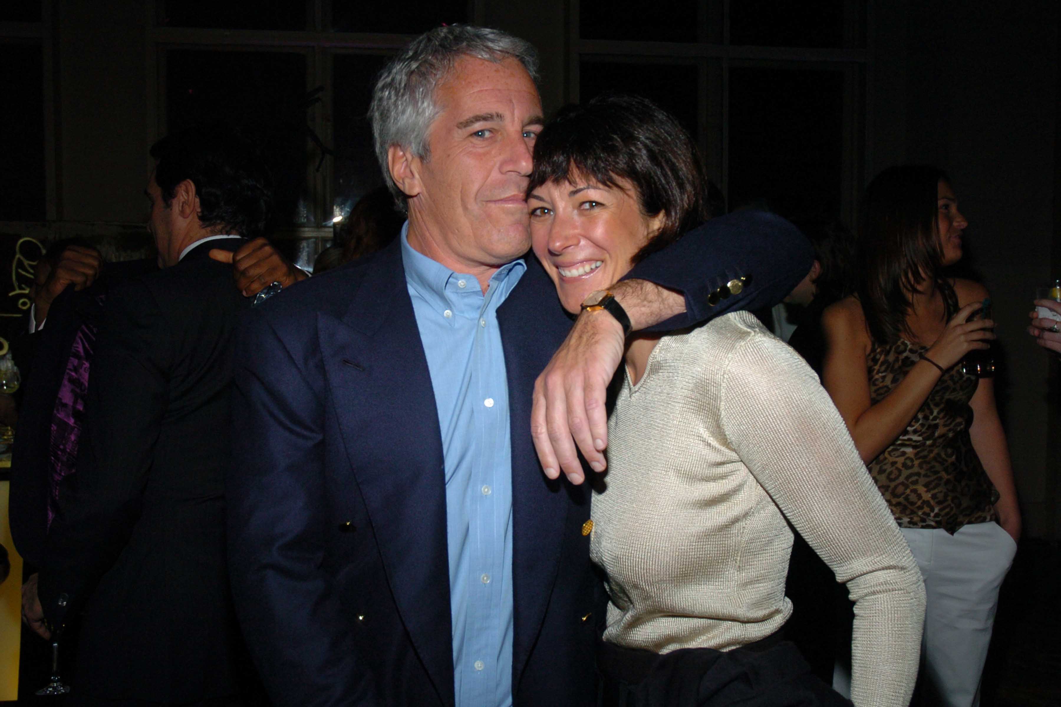Jeffrey Epstein kisses the head of Ghislaine Maxwell