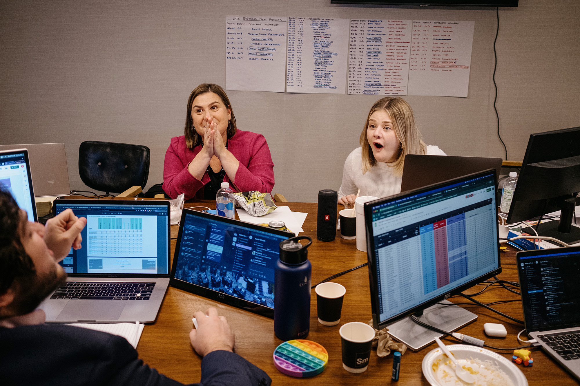 Slotkin and campaign manager Emma Grundhauser react to hearing how they’ve won the city of Howell by 13 votes the day after Election Day in East Lansing, Mich.