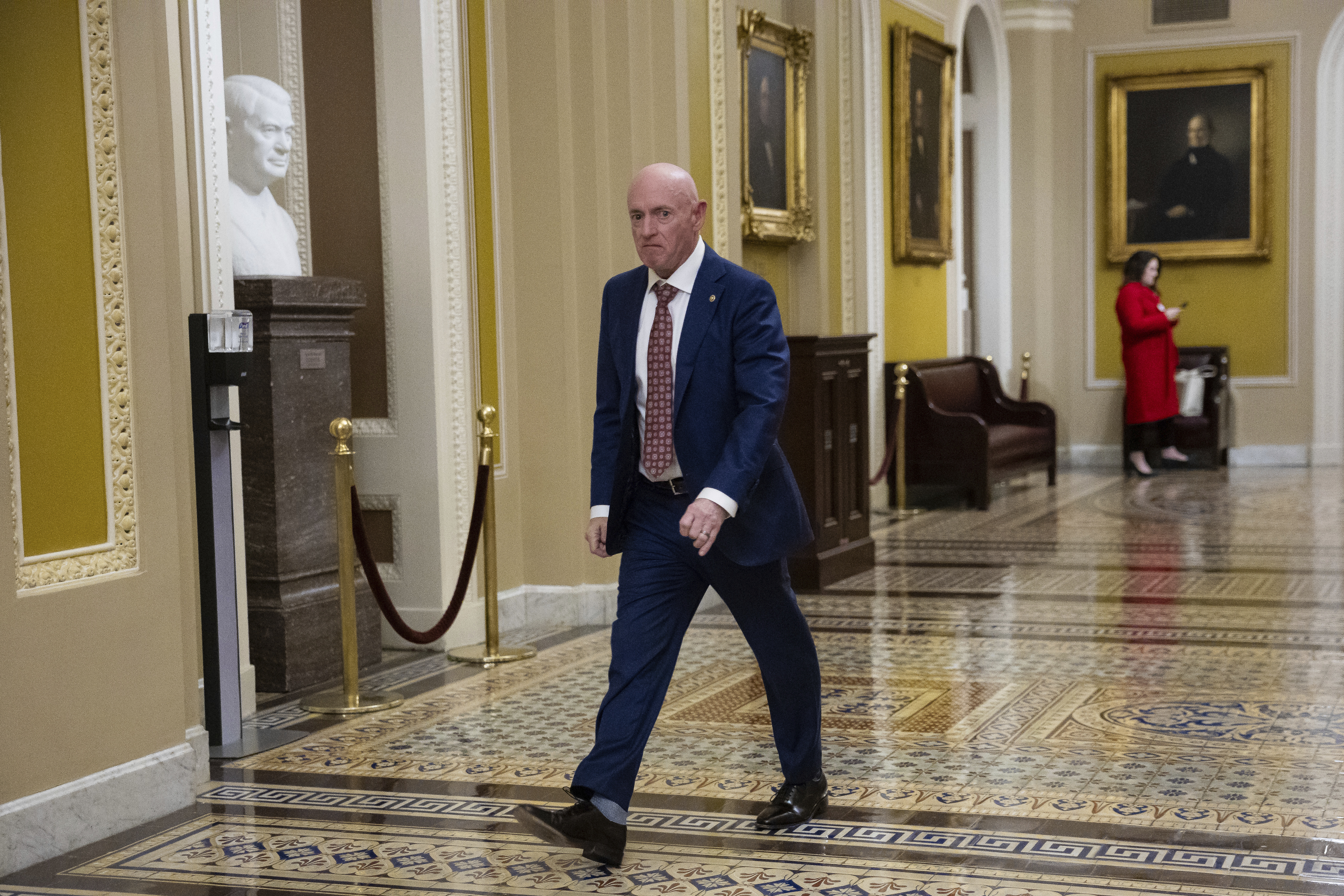 Sen. Mark Kelly (D-Ariz.) walks to a vote at the U.S. Capitol Feb. 26, 2025.