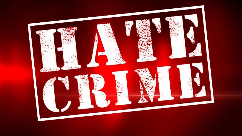 Stylized “HATE CRIME” text on a red background with a white border