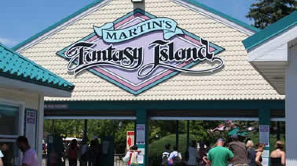 Large decorative sign reading “Martin’s” and “Fantasy Island” above a theme park entrance.