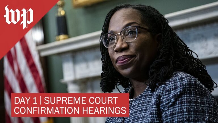 Person wearing glasses in front of U.S. flag; text reads “DAY 1 | SUPREME COURT CONFIRMATION HEARINGS”.