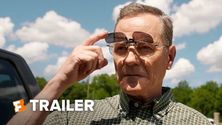 Older man adjusting round sunglasses with drone-like device outdoors in daylight.