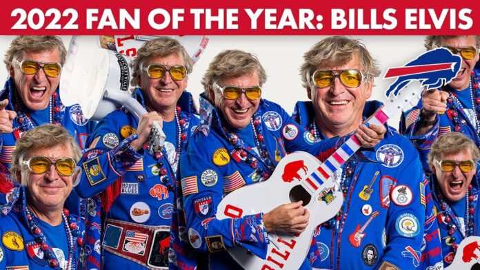 Men in blue Bills-themed outfits with yellow sunglasses celebrate holding a football and sign.