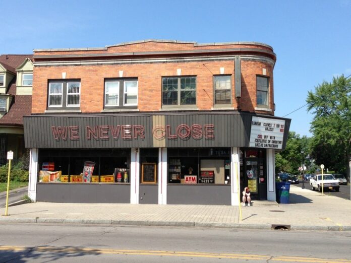 Brick storefront with a large sign reading “WE NEVER LOSE.”