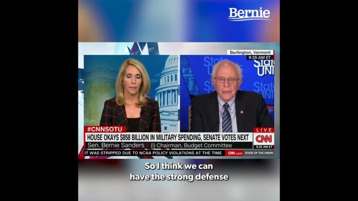Two anchors on a split screen with Bernie Sanders; lower-third graphics show a CNN live segment.