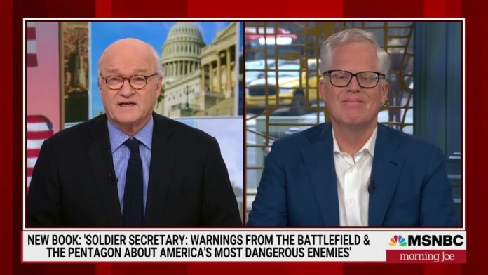 Two men in a split-screen TV interview, with “Morning Joe” logo at right.