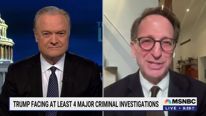 Split-screen on MSNBC shows two men in suits during a live interview segment.