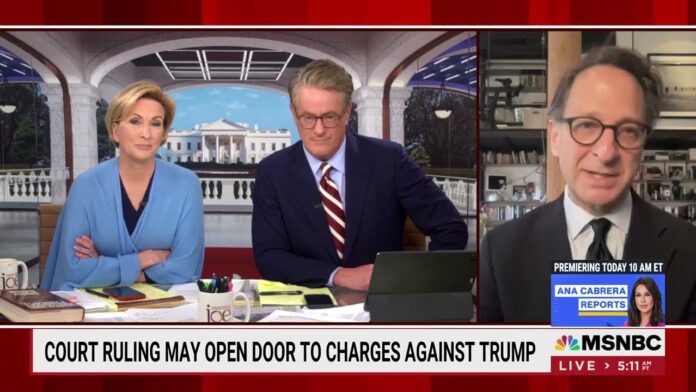 Two hosts at a desk with a guest shown on a split-screen interview.