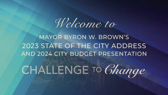Slide says “Welcome to” followed by Mayor Byron W. Brown’s state of the city address and budget.