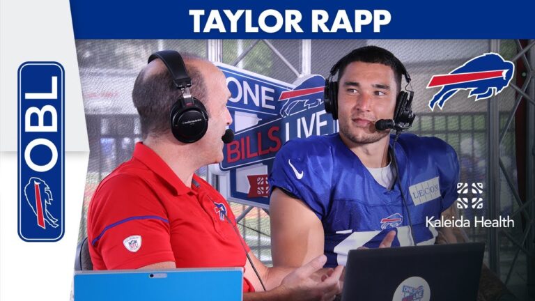 Man in Bills jersey speaks into a headset microphone during a studio interview.