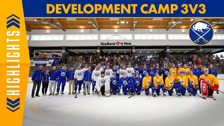 Two teams pose on ice at an indoor rink under a banner reading “DEVELOPMENT CAMP 3V3.”