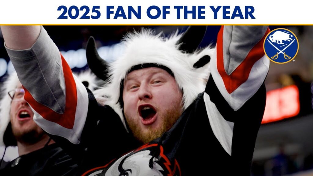 Hockey fan in Buffalo Sabres gear cheering with arms raised under a 2025 fan banner.