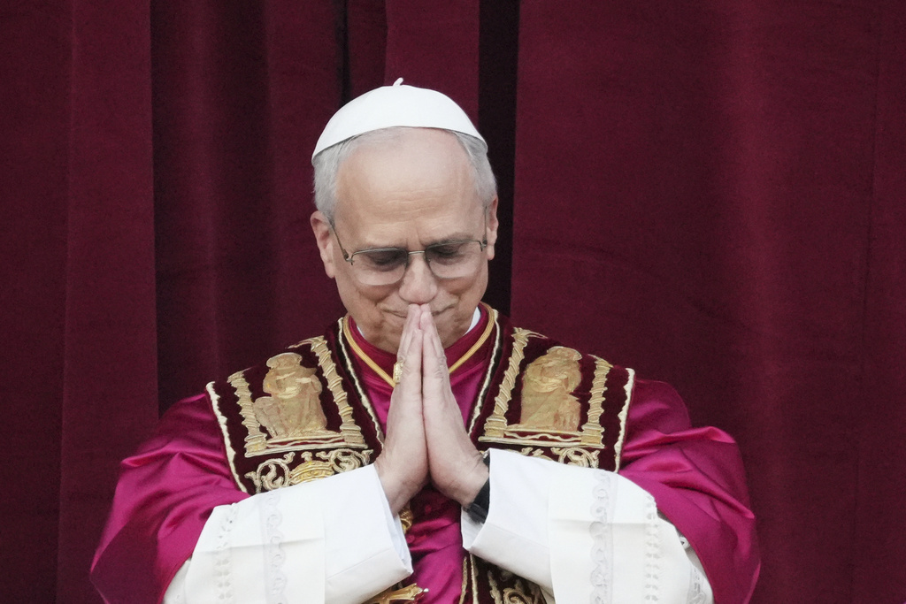 Pope Leo XIV holds his hands in prayer