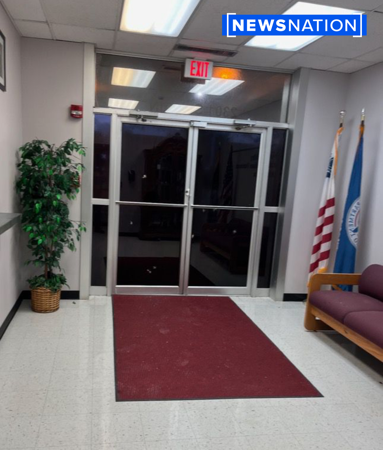 Bullet holes in a glass door