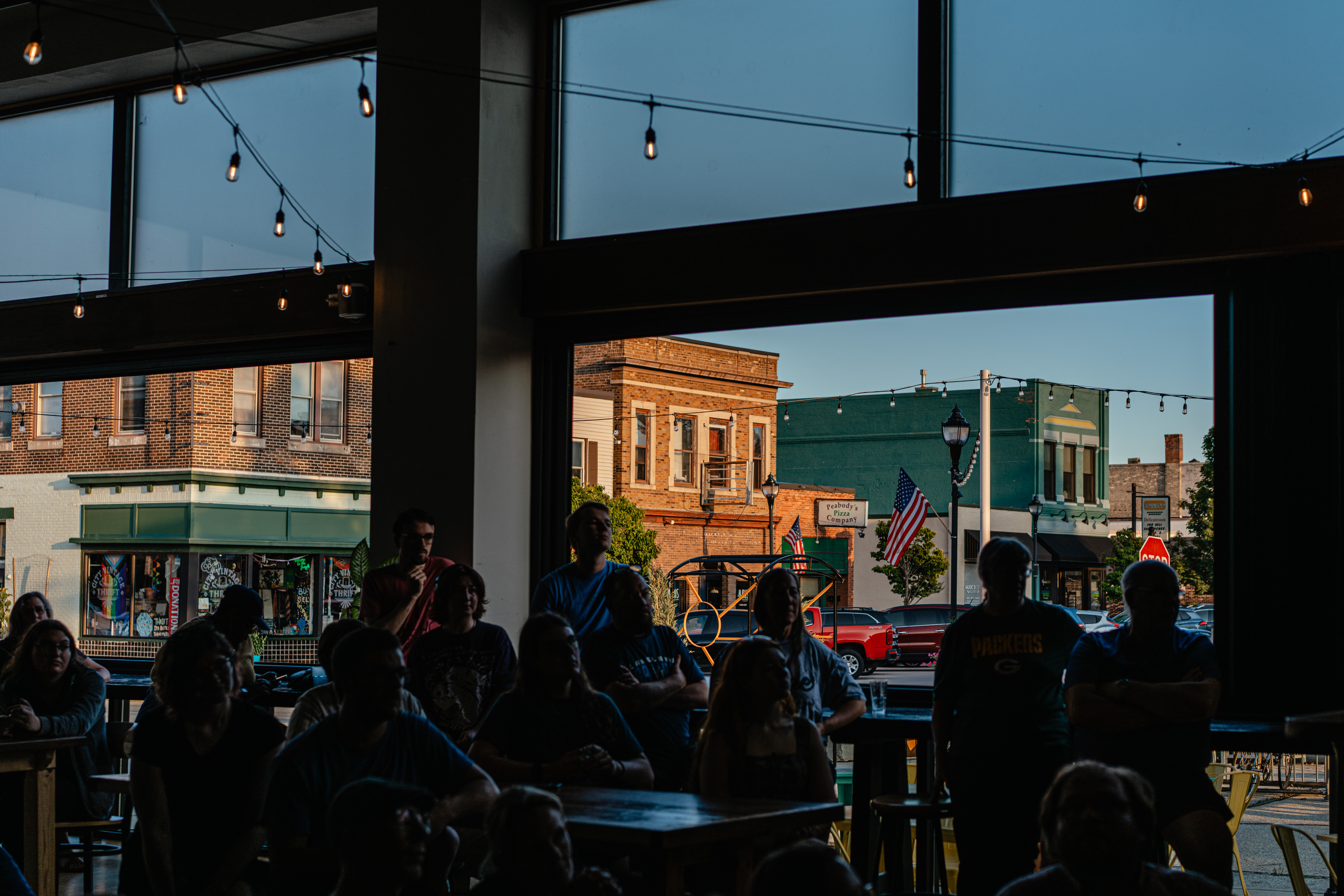 People listen to Hong speak at Paradigm Coffee and Music in Sheboygan on Aug. 8.