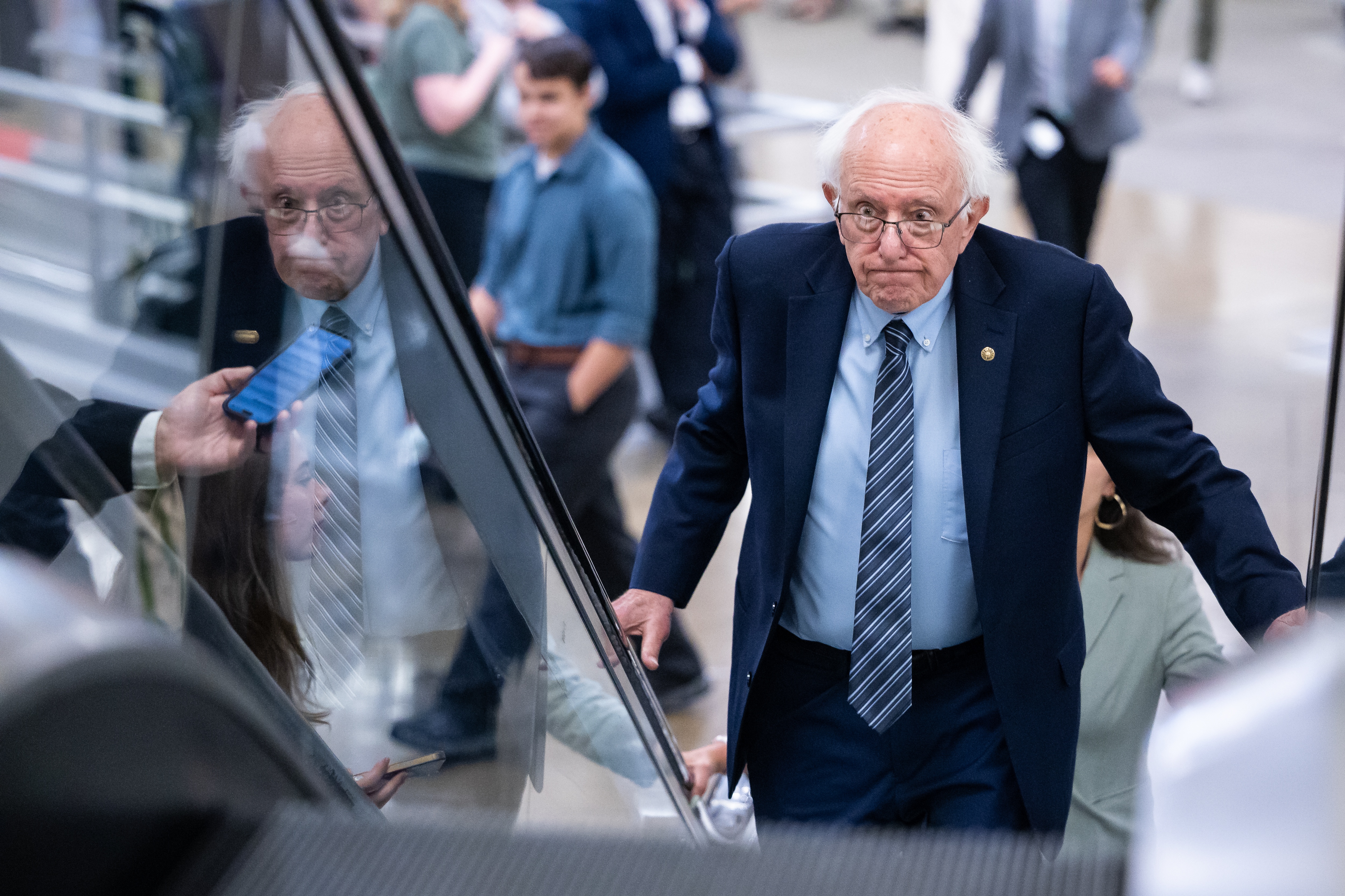 Sen. Bernie Sanders (I-Vt.) ascends on an escalator on his way to a vote at the U.S. Capitol in Washington, on July 30.